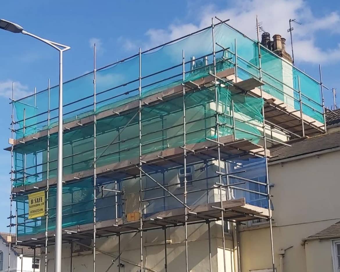 Blue net scaffolding covering a UK property BSafe