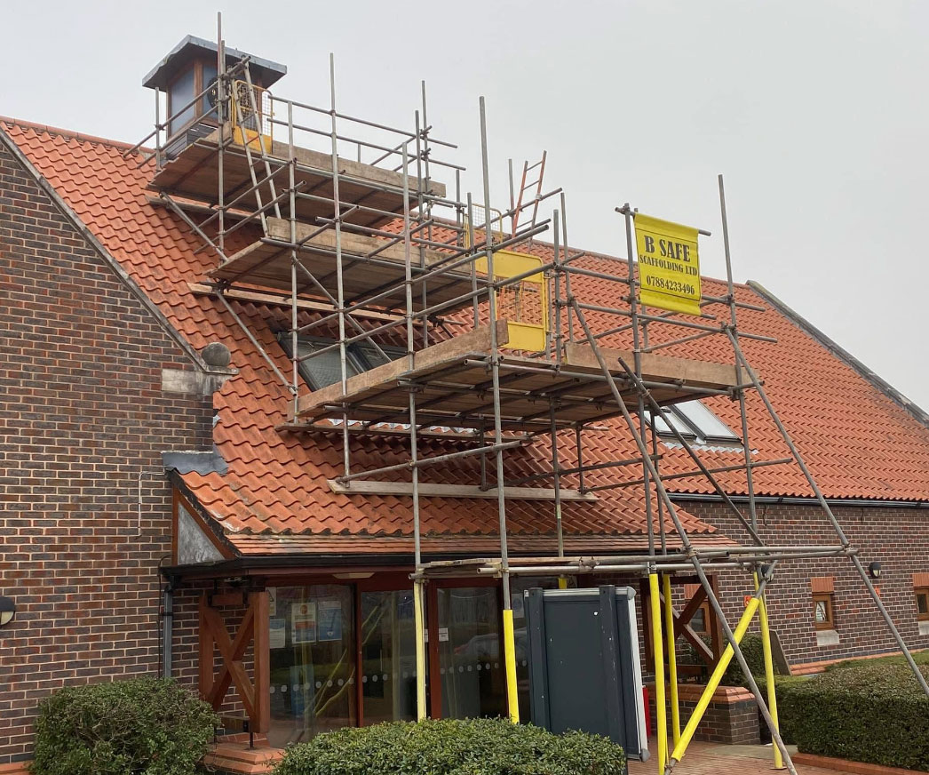 scaffolding on slanted roof